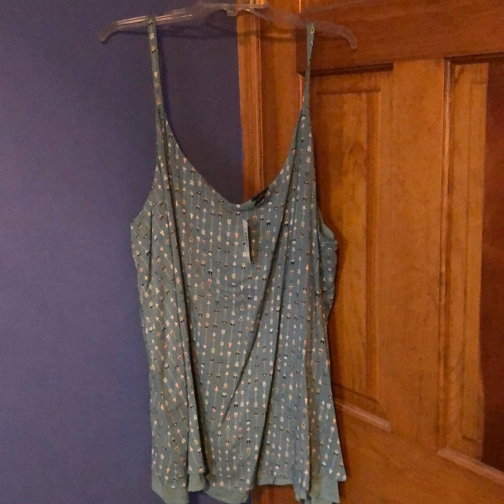 Teal tank top with white designs